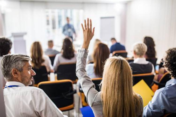 raised hands in a meeting