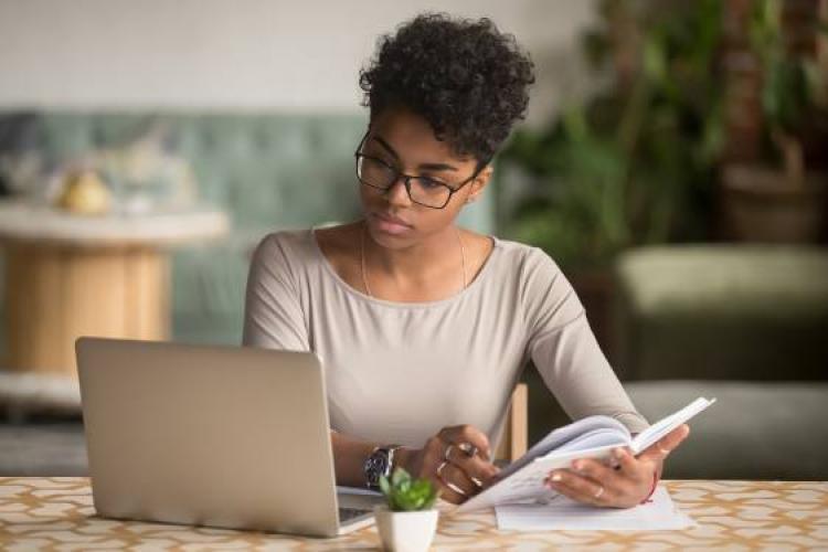 woman looking at a computer