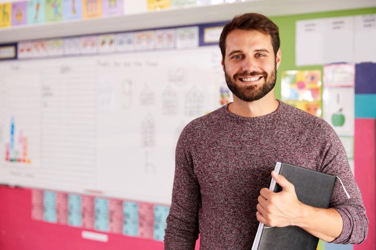 male teacher in a classroom